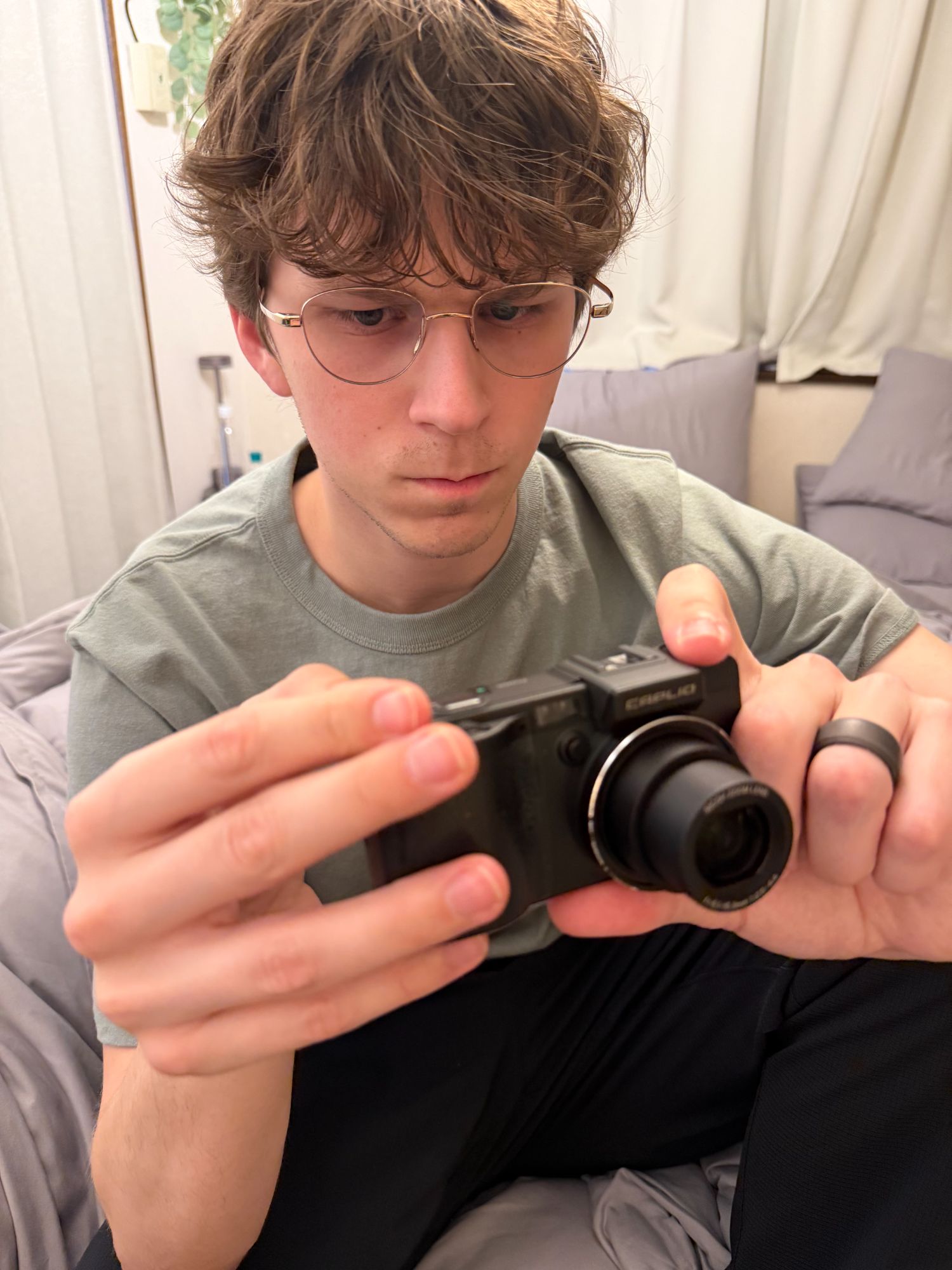 Calvin with his new digital camera he bought at the vintage camera store