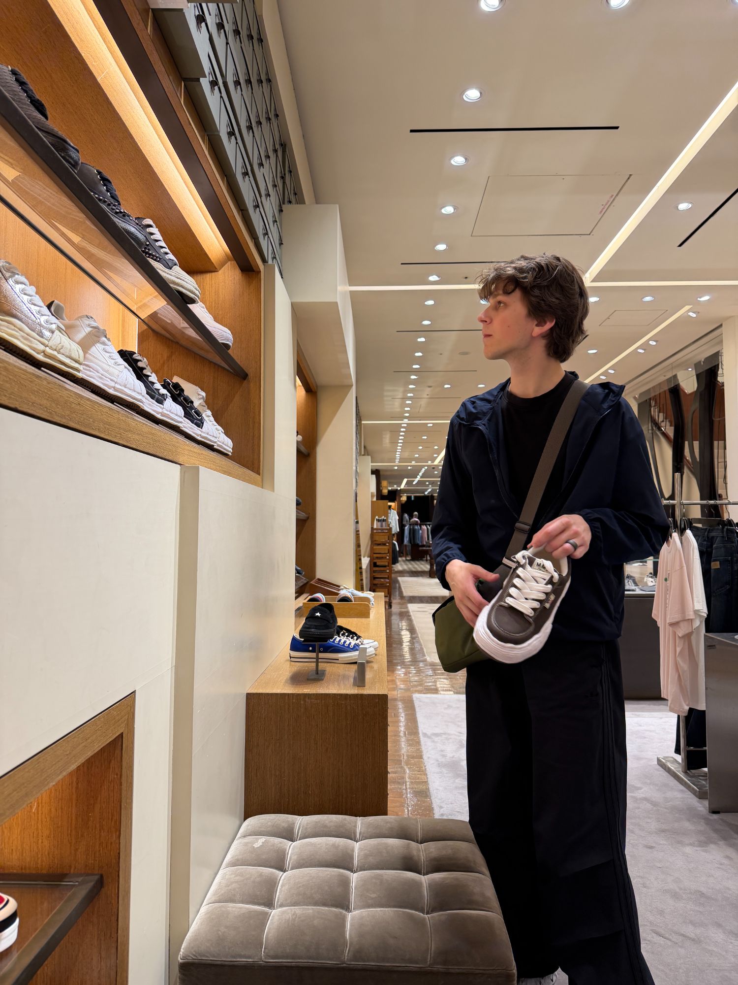 Calvin looking at Maison Mihara Yasuhiro shoes